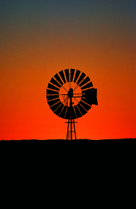 Windmill against an orange sunrise